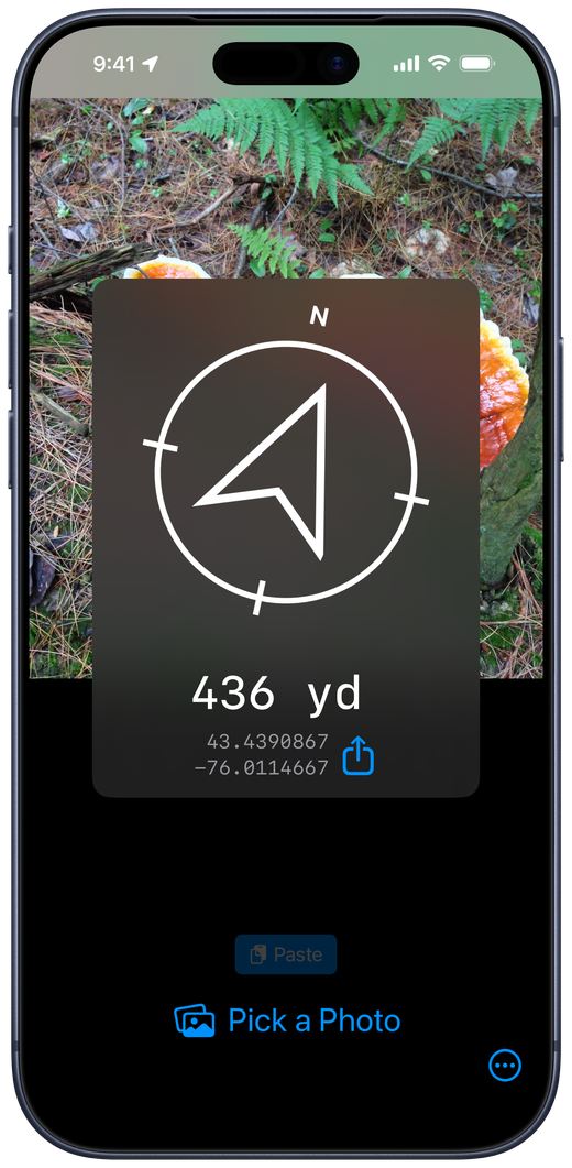 Photo Find showing a compass arrow to a saved photo location on iPhone
